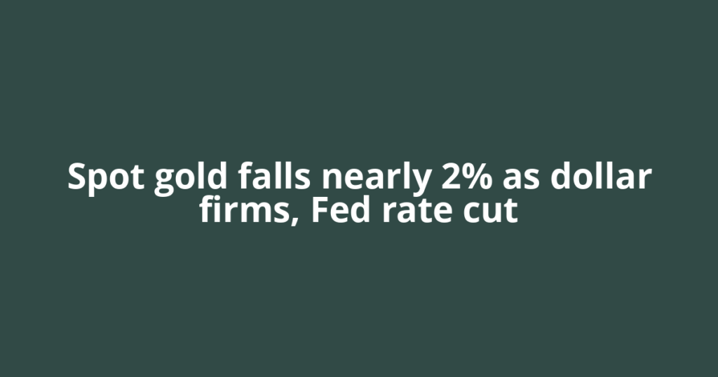 Spot gold falls nearly 2% as dollar firms, Fed rate cut