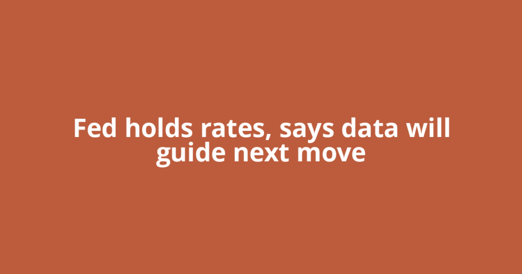 Fed holds rates, says data will guide next move